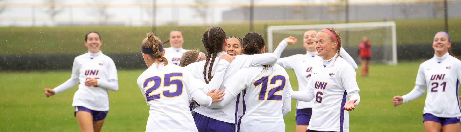 UNI soccer team celebrating after a goal